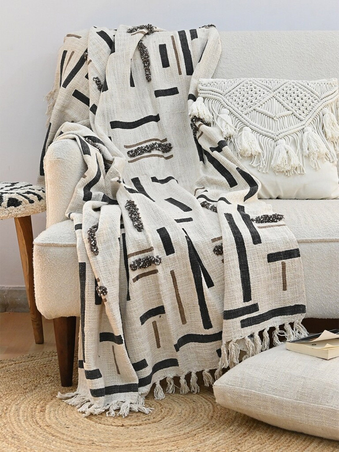 

Art Avenue Off White & Black Self Design Cotton Rectangular Throw