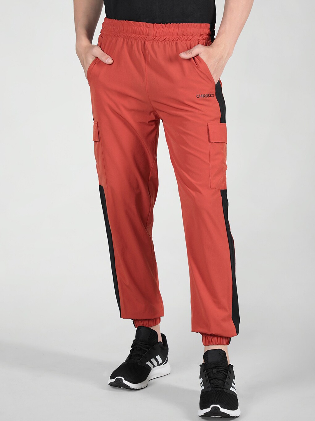

CHKOKKO Men Mid-Rise Elasticated Sports Joggers, Orange