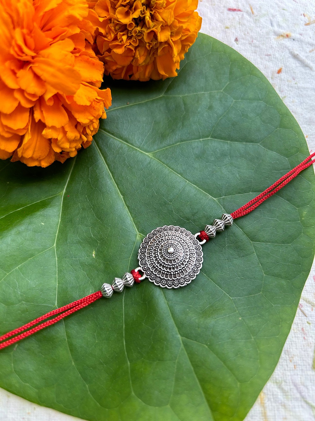 

FIROZA Men Conical Sacred Rakhi, Silver