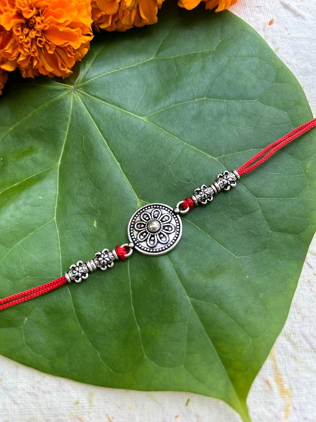 

FIROZA Men Anemone Sacred Rakhi, Silver