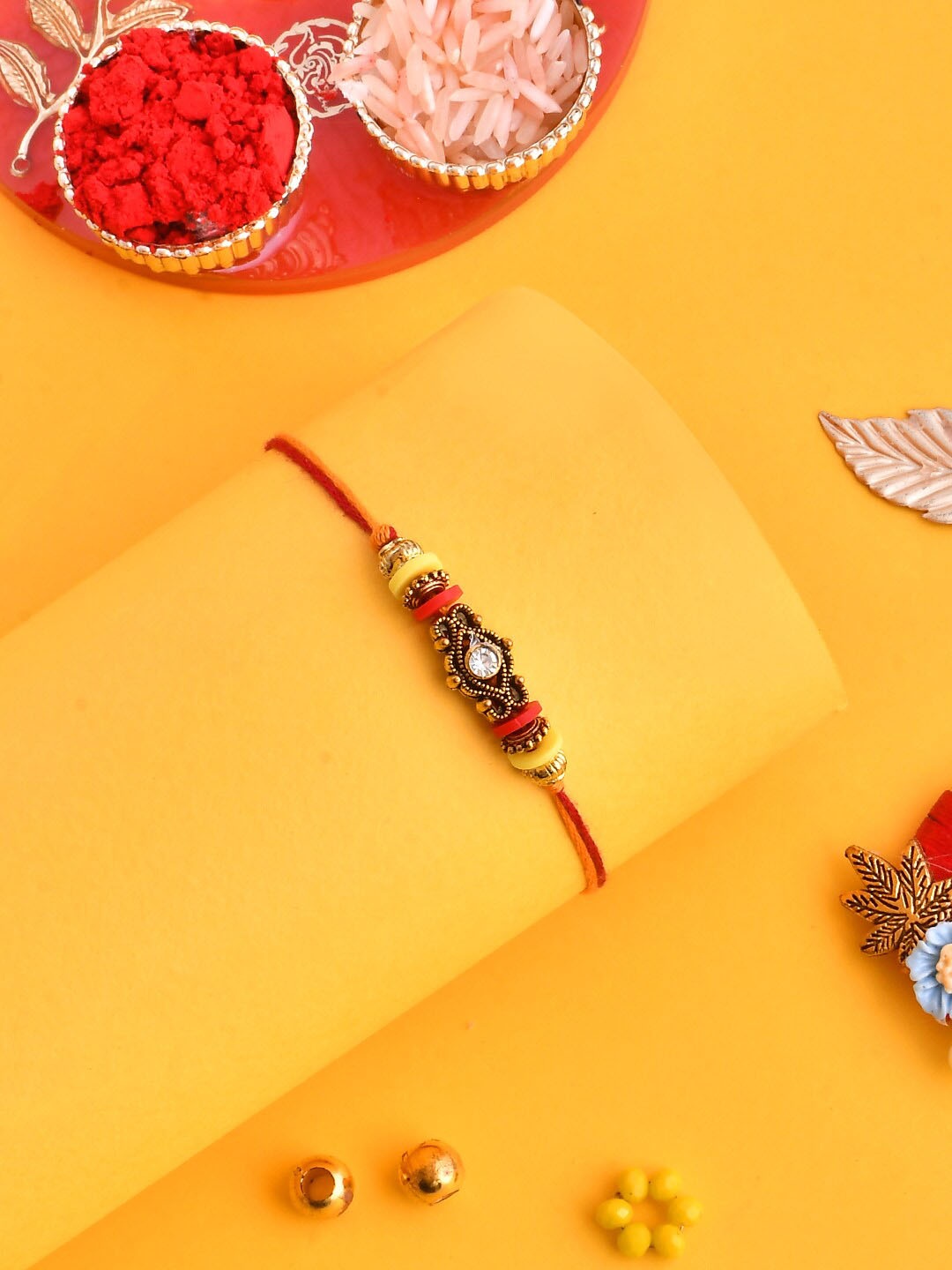 

Aapno Rajasthan Men Antique Motif Crystal-Studded & Beaded Rakhi, Red