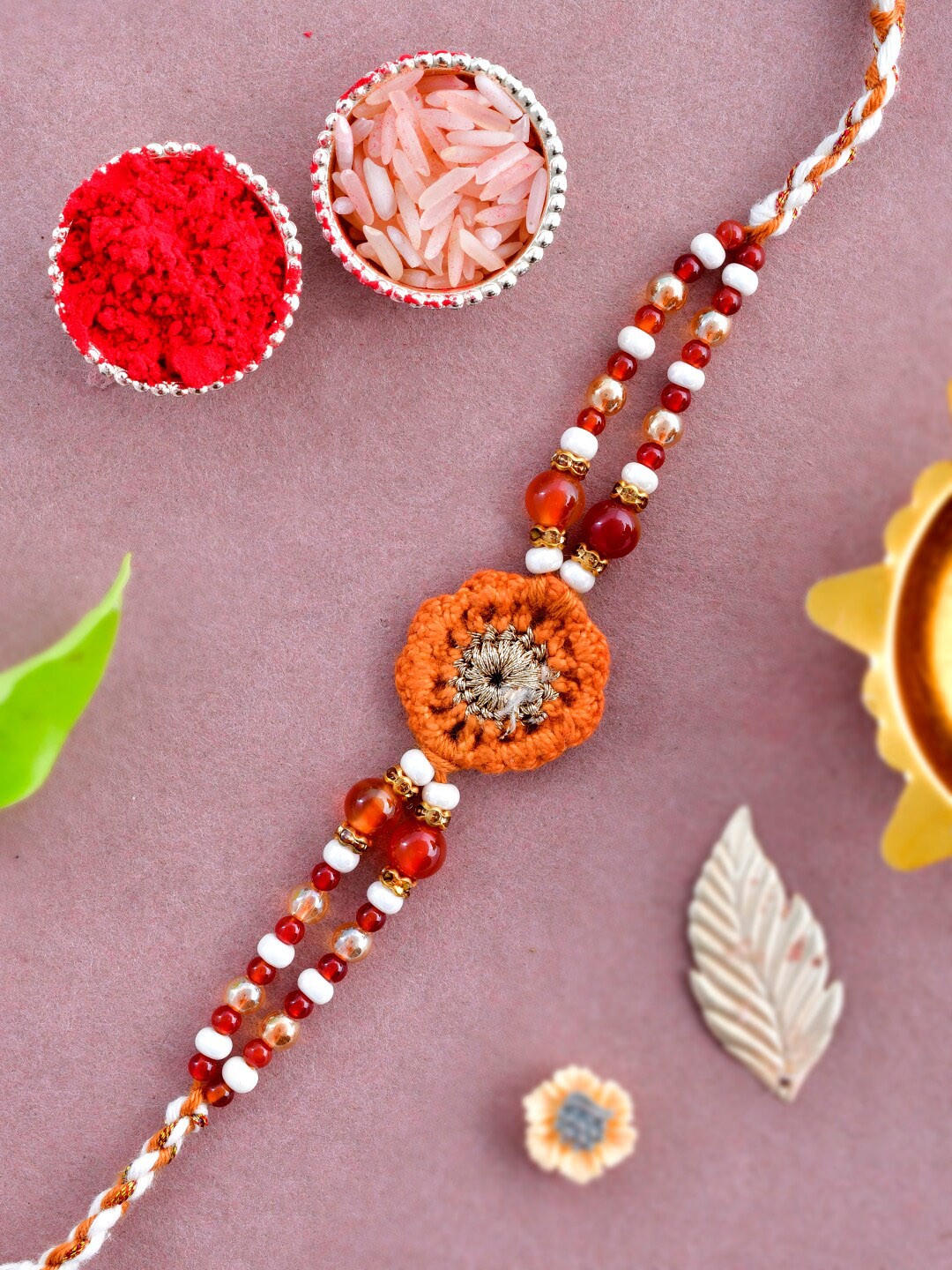 

Aapno Rajasthan Wool Knitted & Pearl Beaded Rakhi, Brown