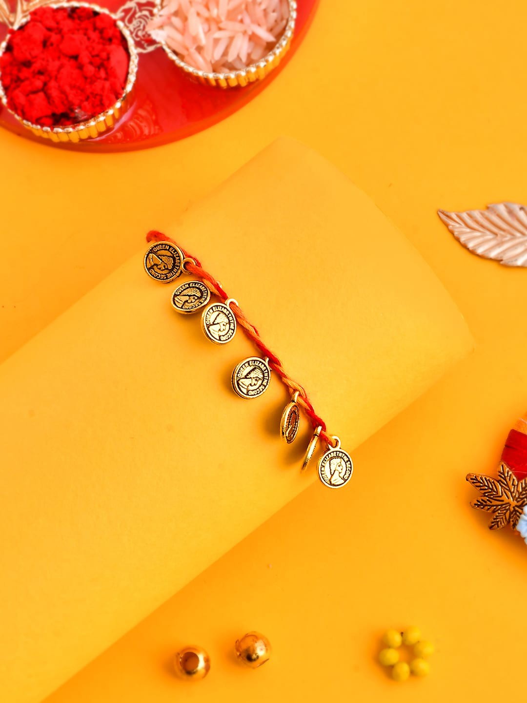 

Aapno Rajasthan Men Golden Coin Woven Braided Rakhi With Roli Chawal & Greeting Card, Gold