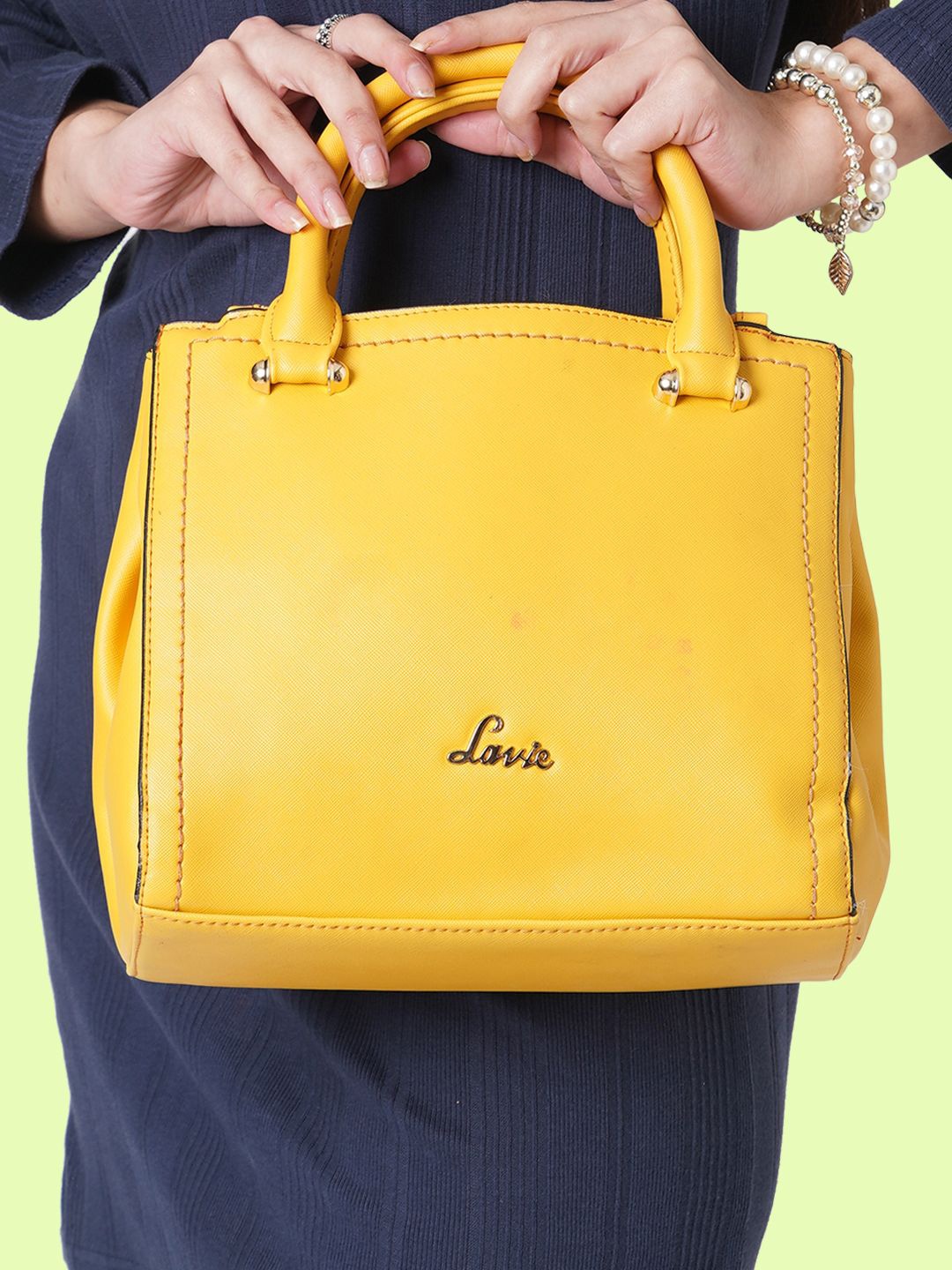 

Lavie Omnia Brown Solid Structured Handheld Bag