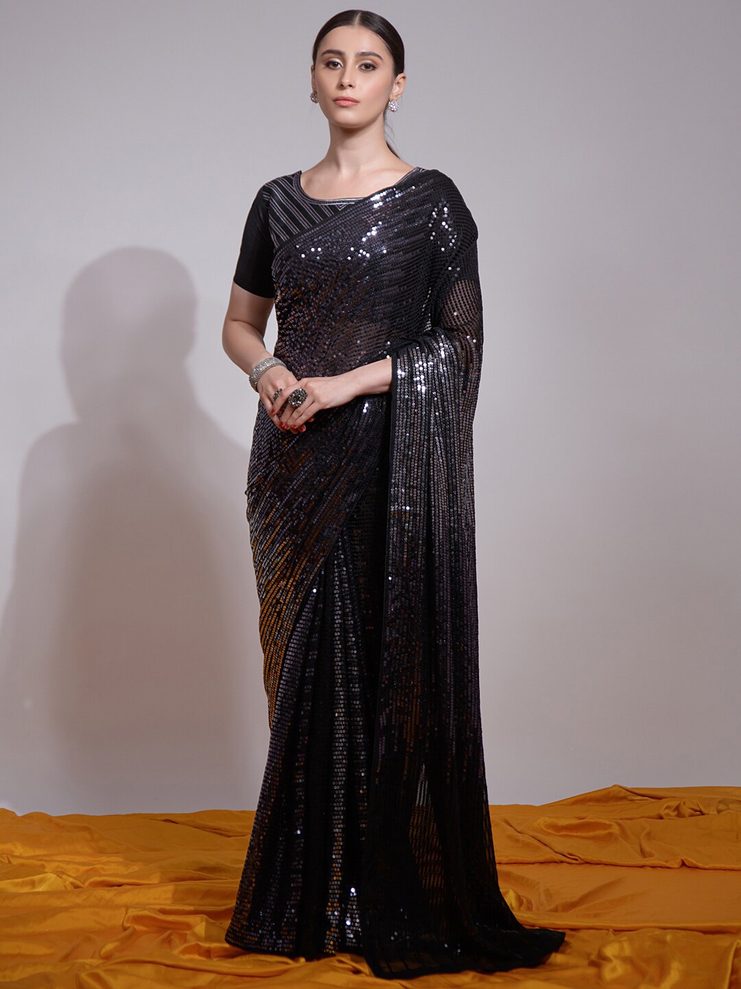 

Mitera Black Embellished Pure Georgette Saree