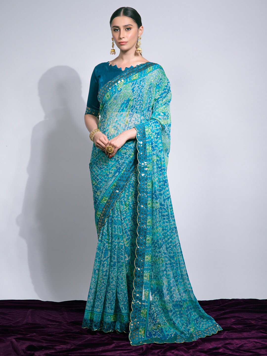 

Mitera Turquoise Blue Abstract Printed Pure Chiffon Saree