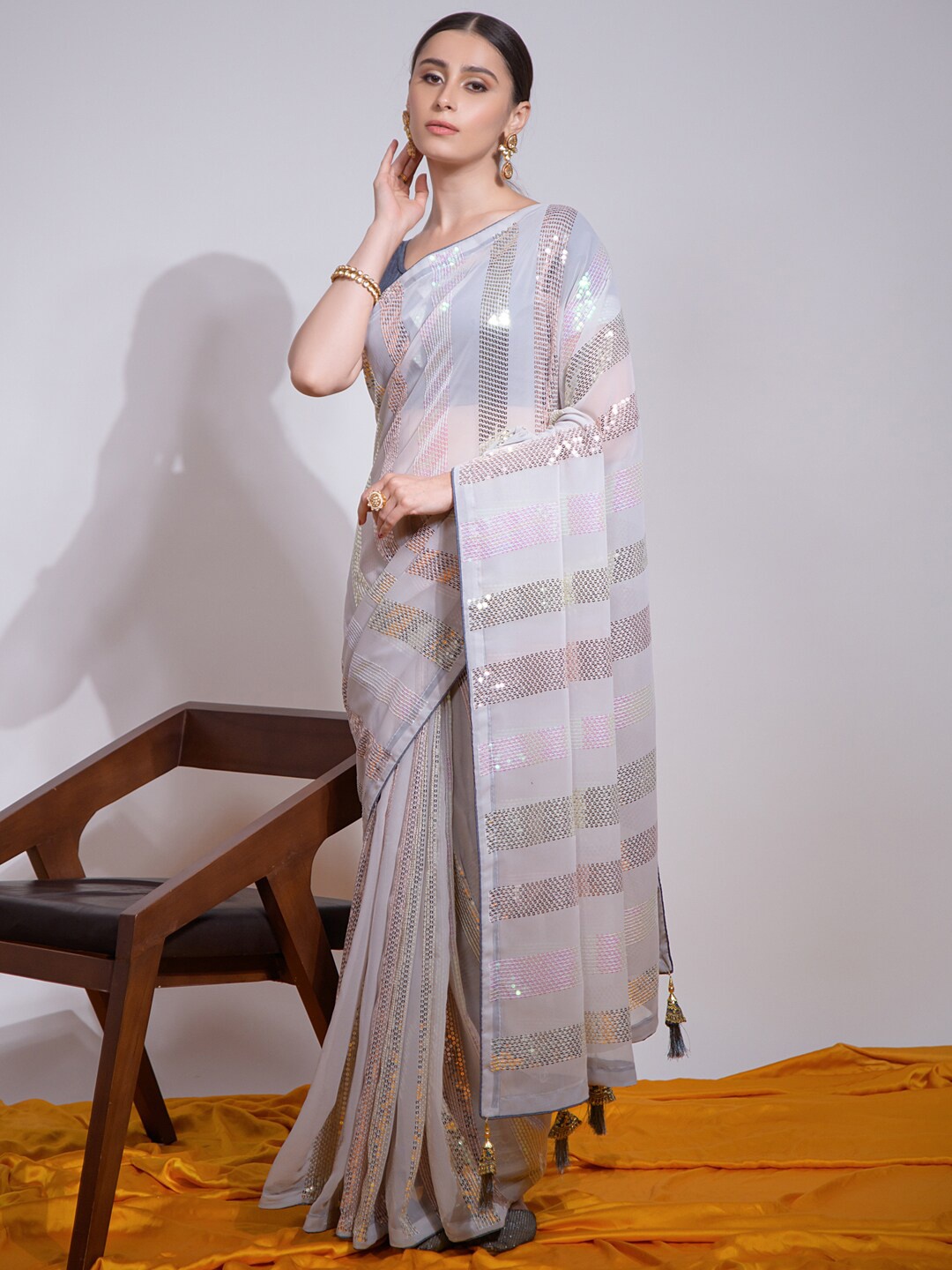 

Mitera White & Pink Embellished Pure Georgette Saree