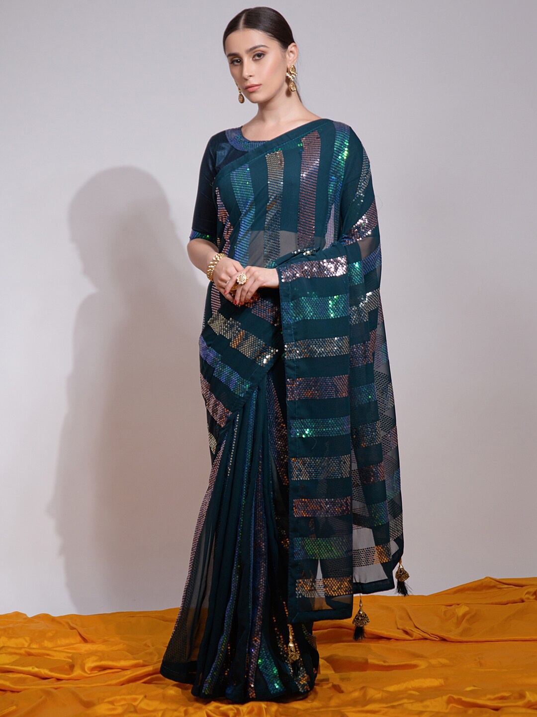 

Mitera Teal Blue Embellished Sequinned Poly Georgette Saree