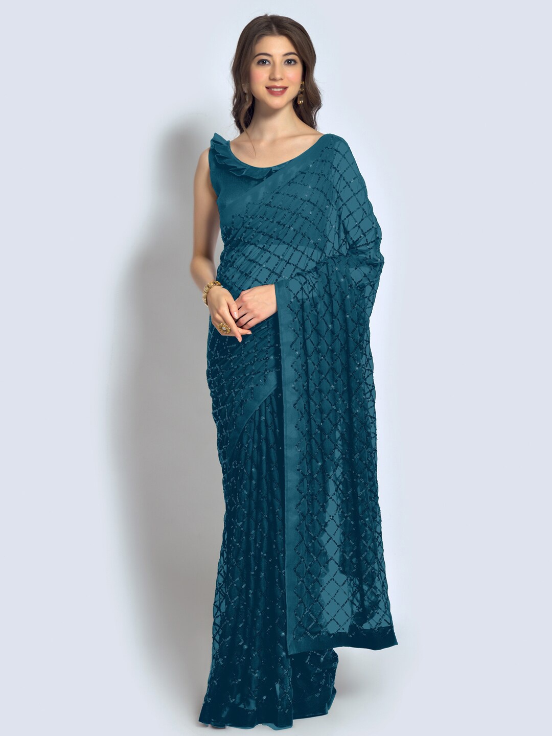

Mitera Teal Geometric Embellished Sequinned Pure Georgette Saree