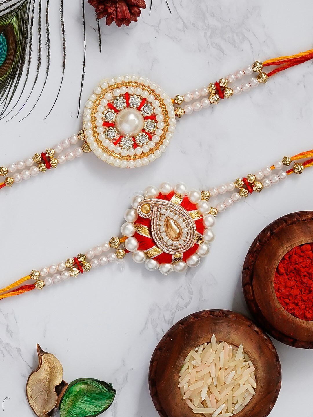 

eCraftIndia Set of 2 Designer Pearl Beaded Rakhis With Roli Chawal Pack, White