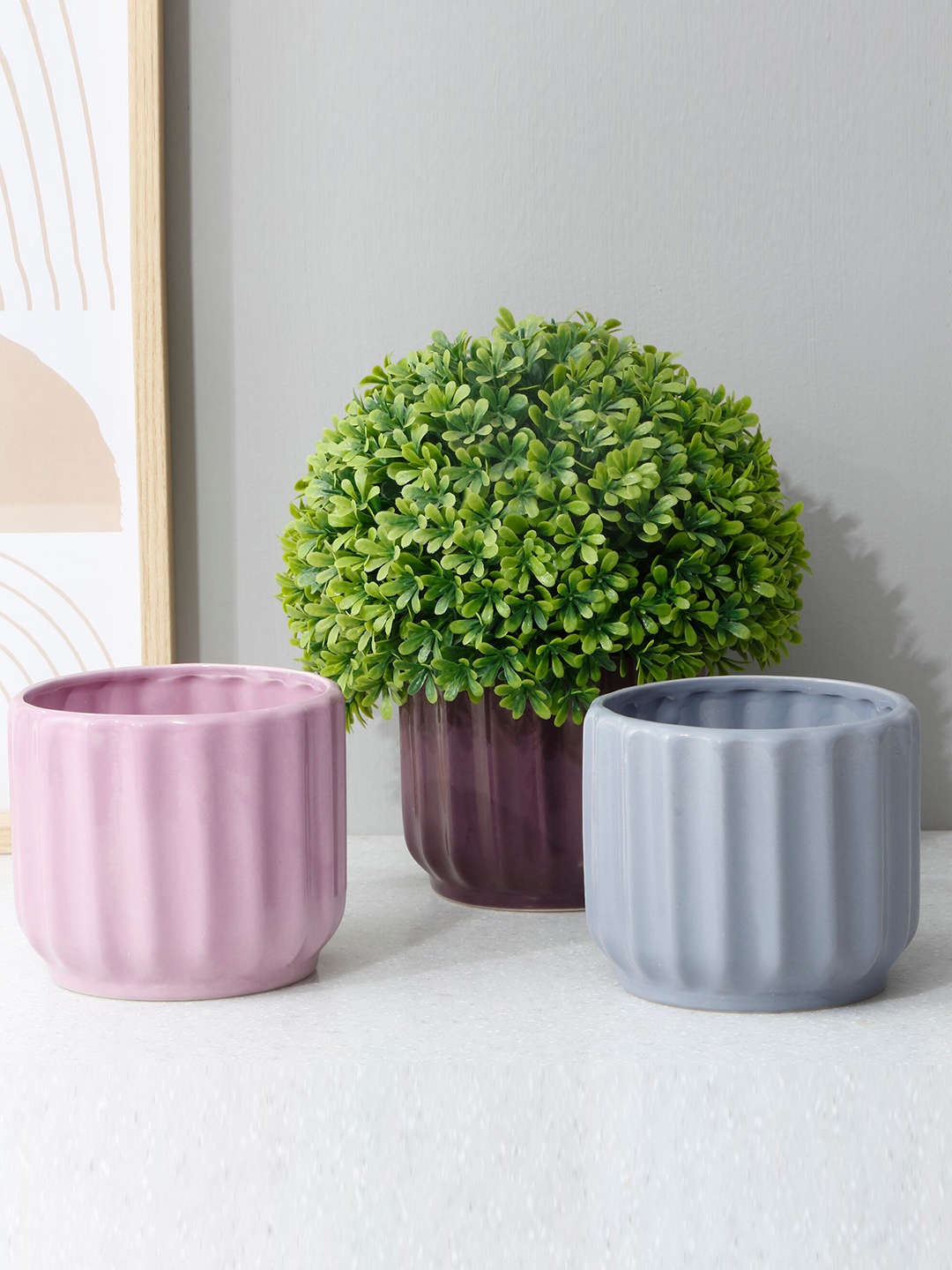 

Home Centre Purple Textured Ceramic Planter