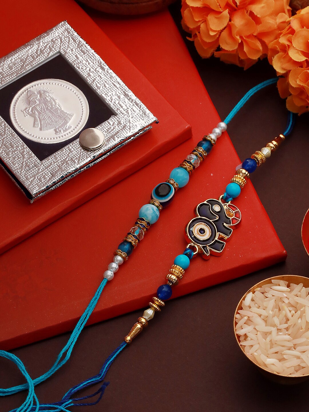 

Saraf RS Jewellery Set Of 2 Evil Eye Designer Rakhi With 10 g 999 Pure Silver Coin, Blue
