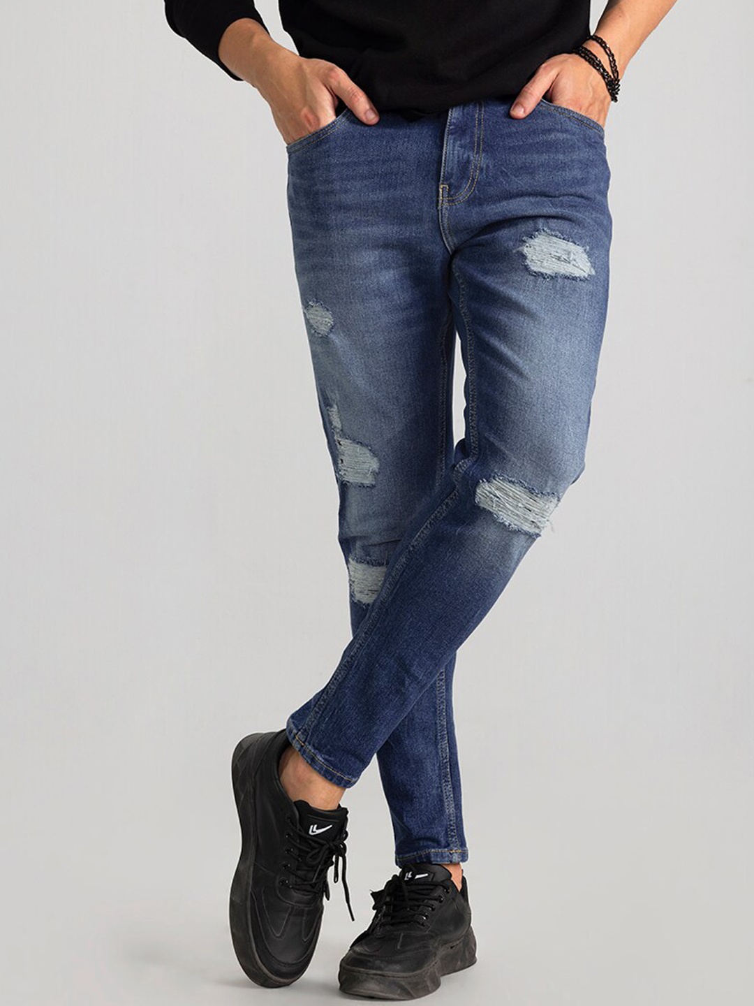 

Snitch Men Blue Skinny Fit Highly Distressed Heavy Fade Stretchable Jeans
