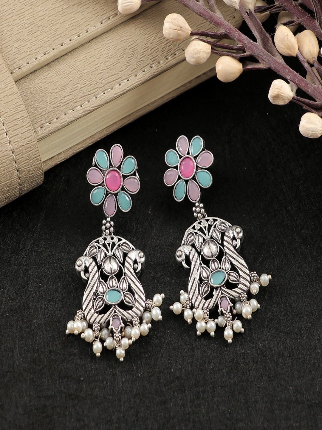

UNIVERSITY TRENDZ Silver Plated Kundan Studded Peacock Shaped Drop Earrings