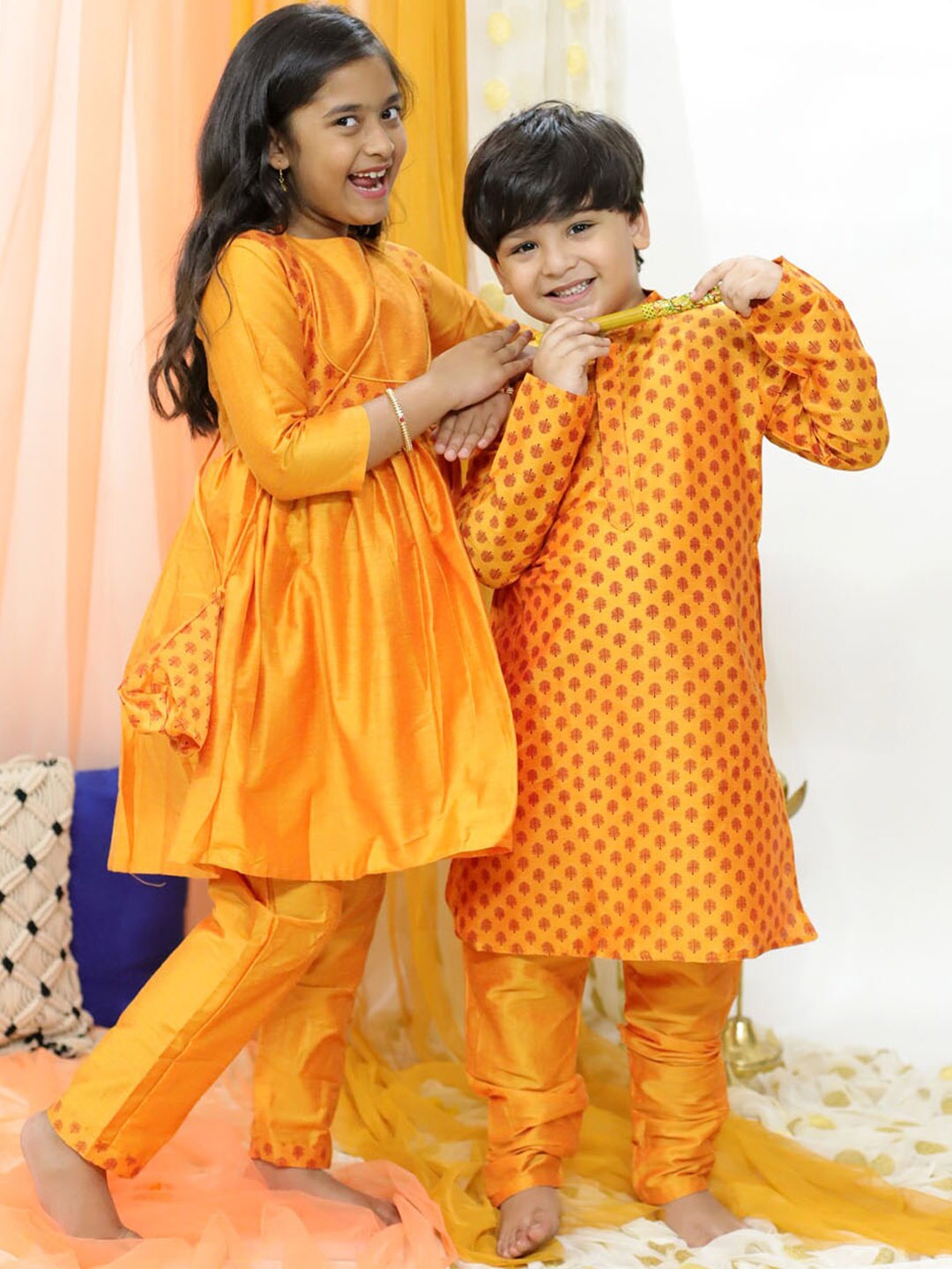 

VASTRAMAY Girls Ethnic Motifs Printed Round Neck Pleated Kurta & Trousers With Potli Bag, Orange