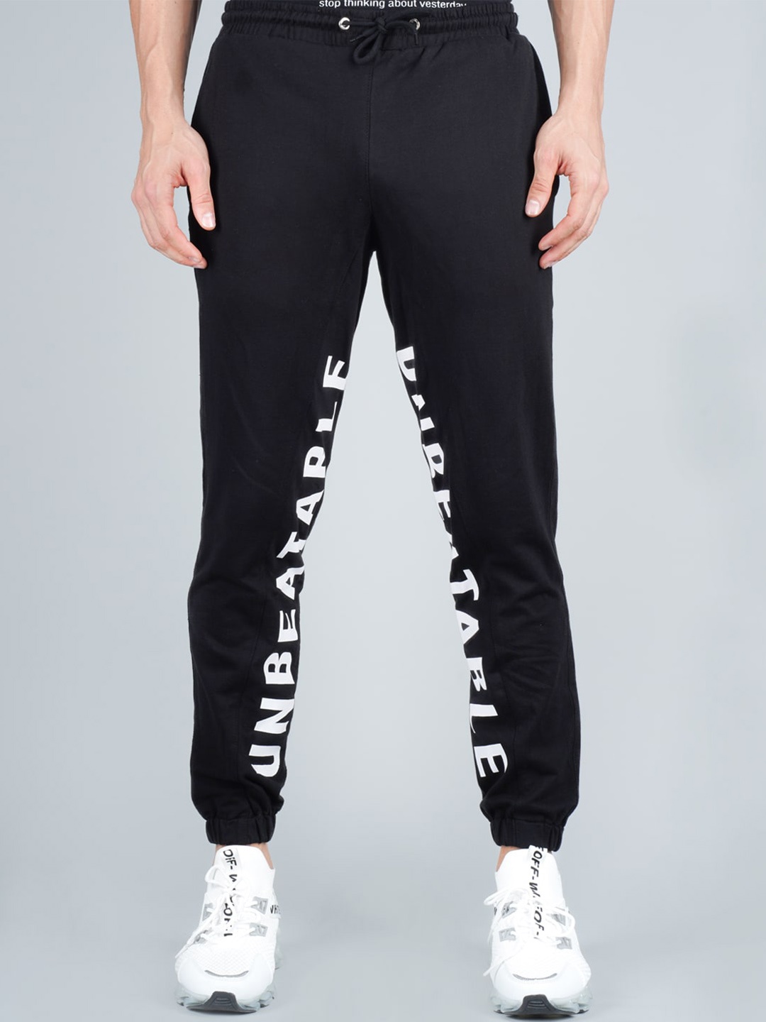

RapidBox Men Typography Printed Mid-Rise Sports Pure Cotton Joggers, Navy blue