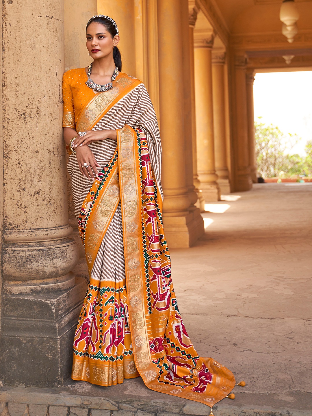 

Mitera Brown & Orange Striped Beads And Stones Patola Saree, White