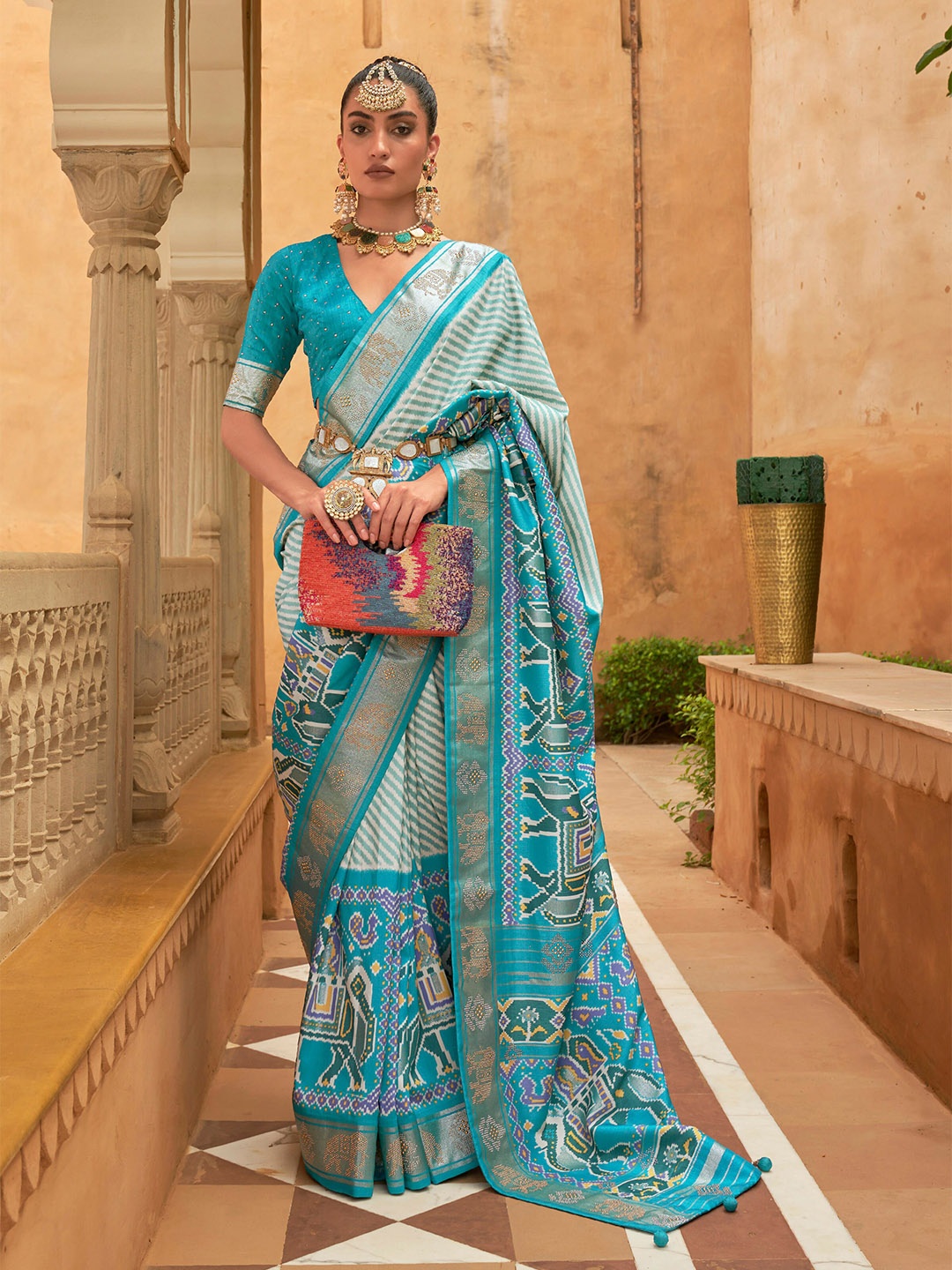 

Mitera Blue & White Striped Beads And Stones Patola Saree