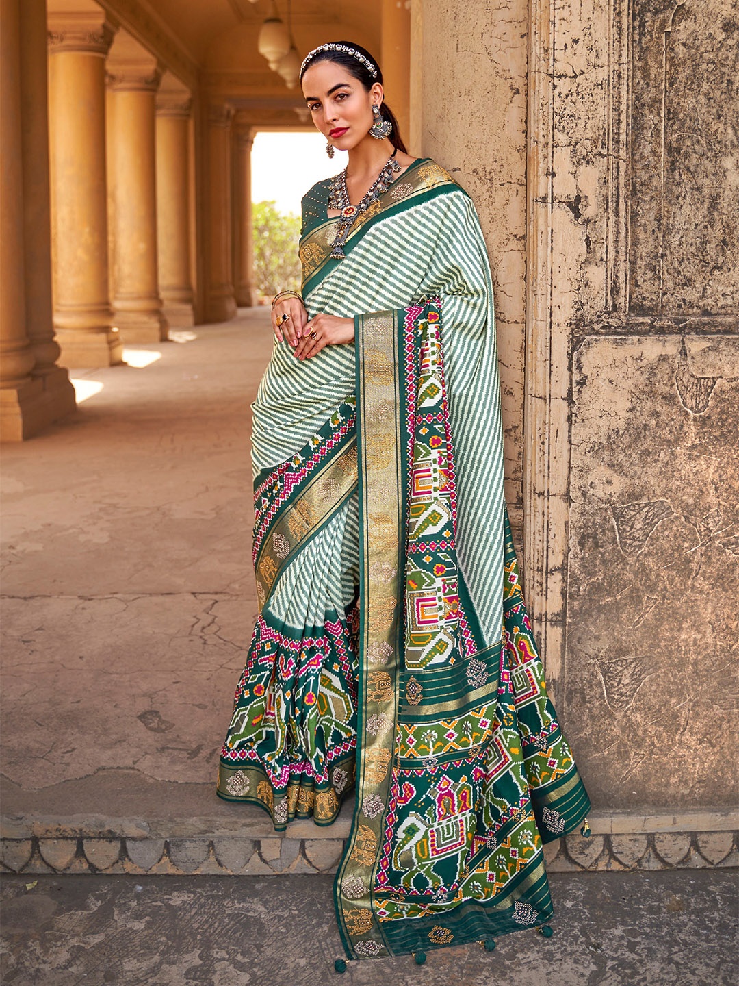 

Mitera Green & White Striped Beads And Stones Patola Saree