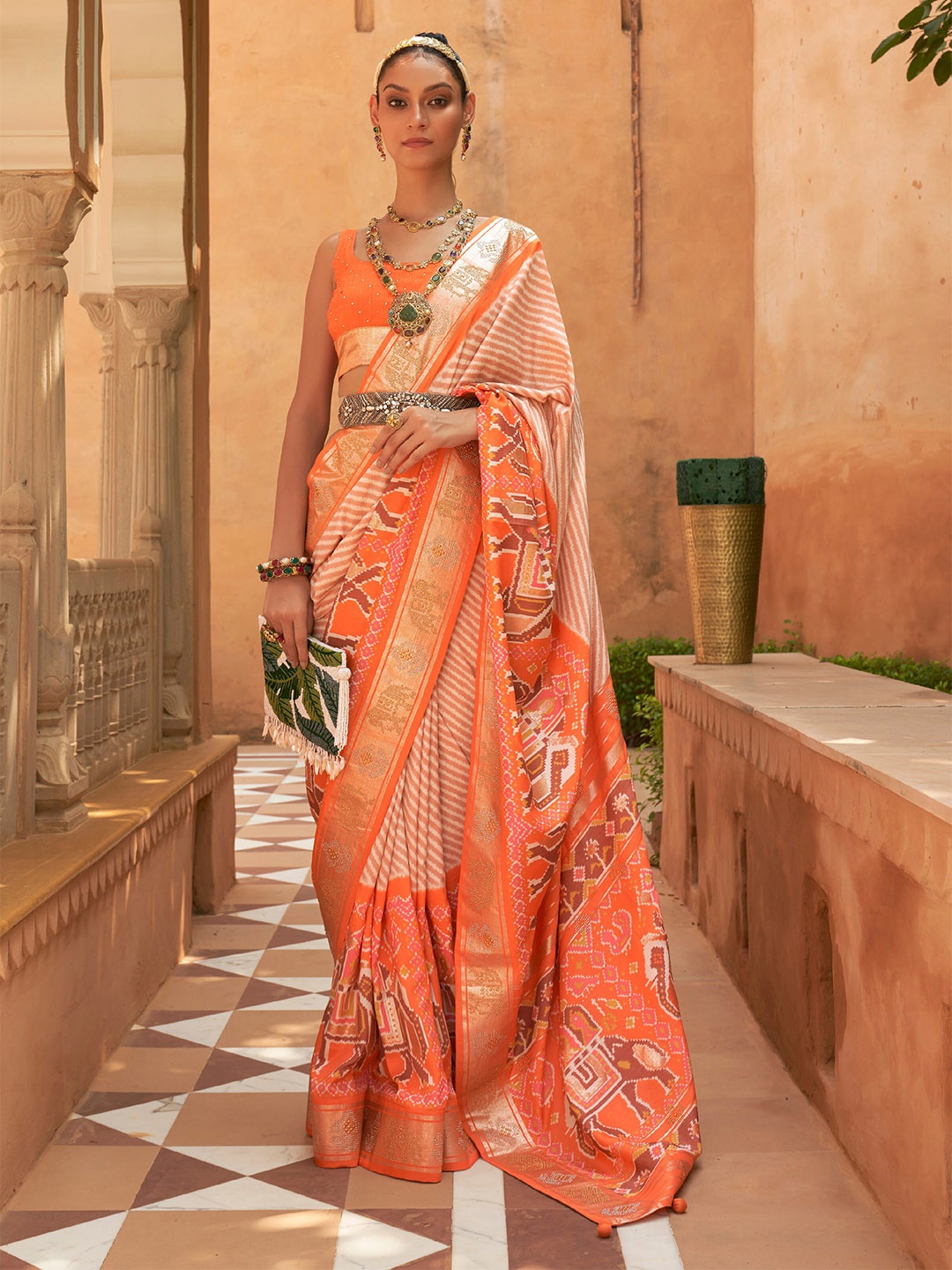 

Mitera Orange & White Striped Beads and Stones Patola Saree