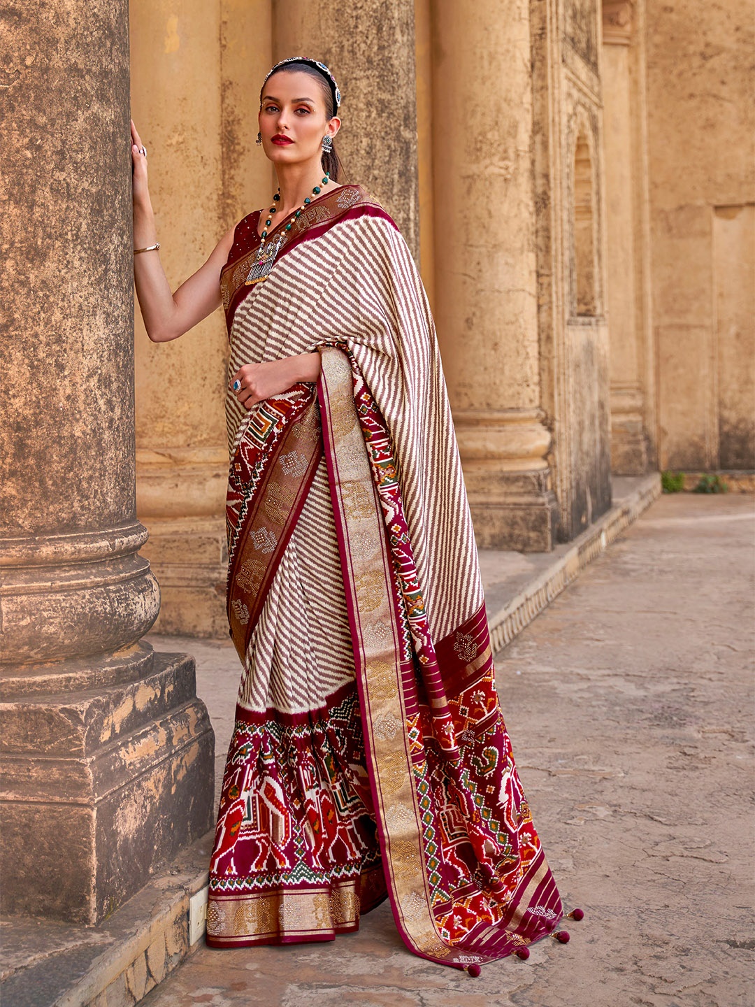 

Mitera Maroon & White Striped Beads and Stones Patola Saree