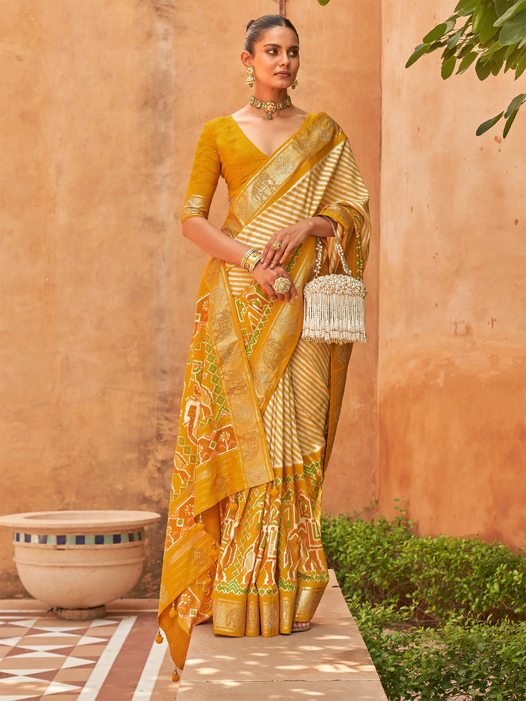 

Mitera Mustard & White Striped Beads and Stones Patola Saree