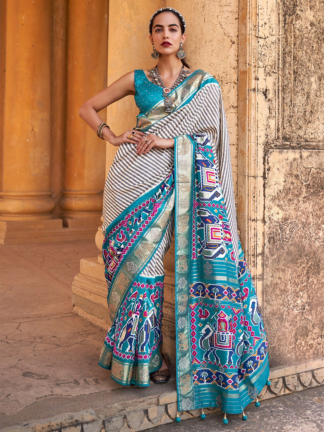 

Mitera Navy Blue & White Striped Beads and Stones Patola Saree