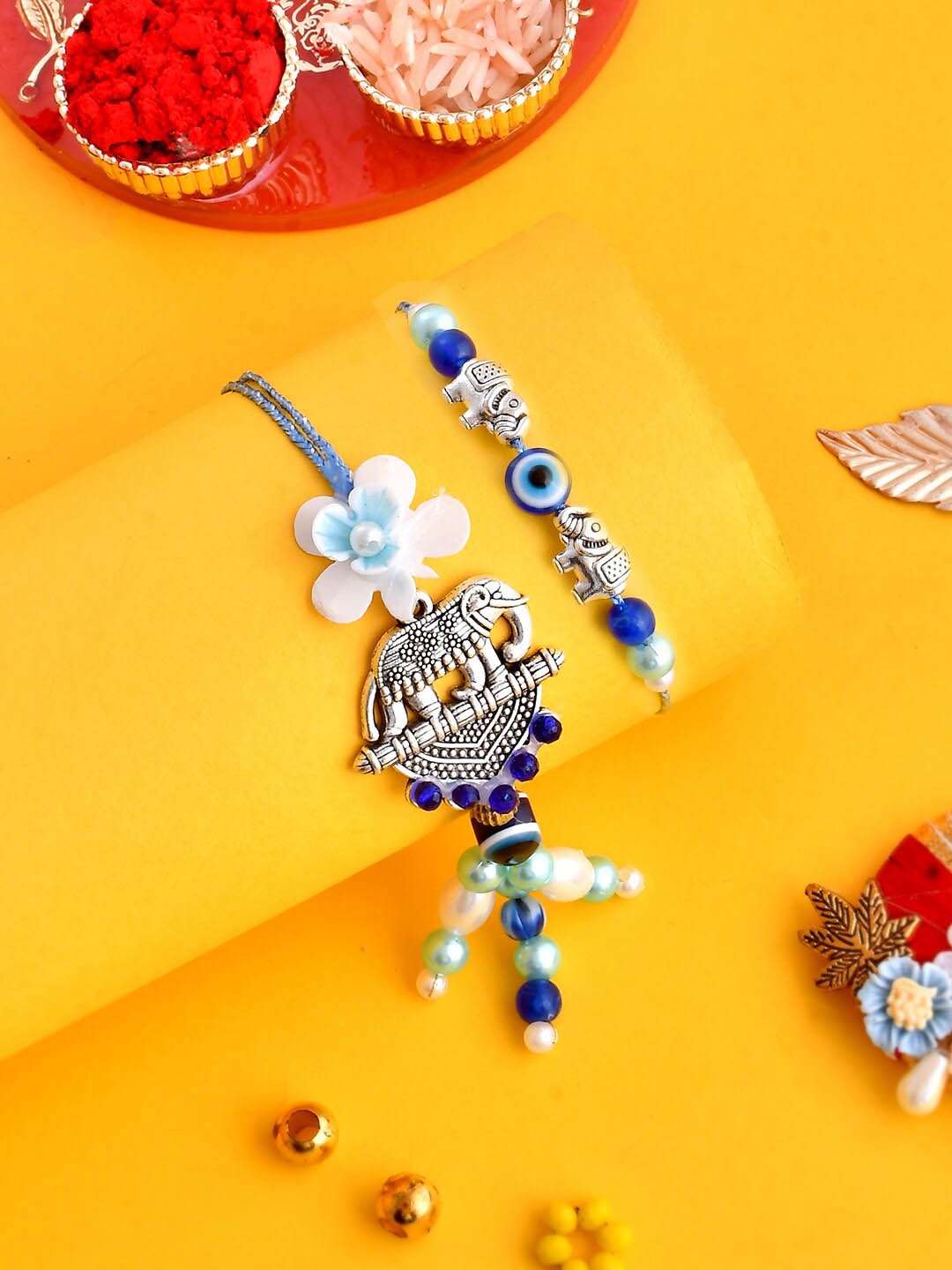 

Aapno Rajasthan Unisex Set Of 4 Elephant Nazar Rakshak Bhaiya Bhabhi Rakhi Set, Blue