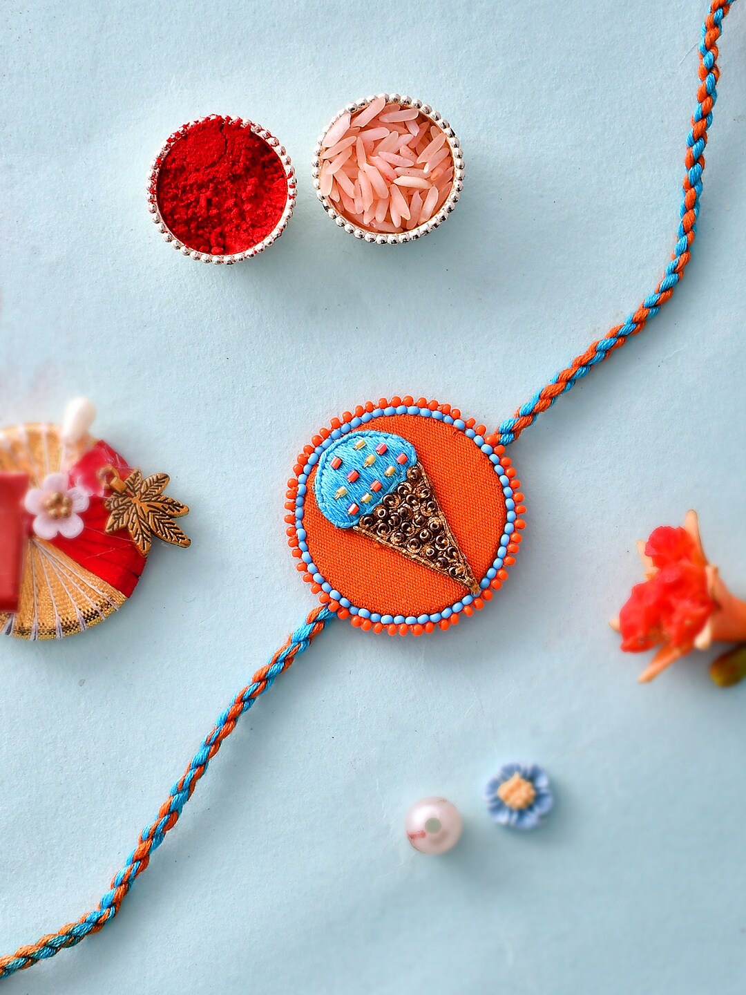 

Aapno Rajasthan Kids Mini Beads Embellished Rakhi With Roli Chawal & Gift Card, Red