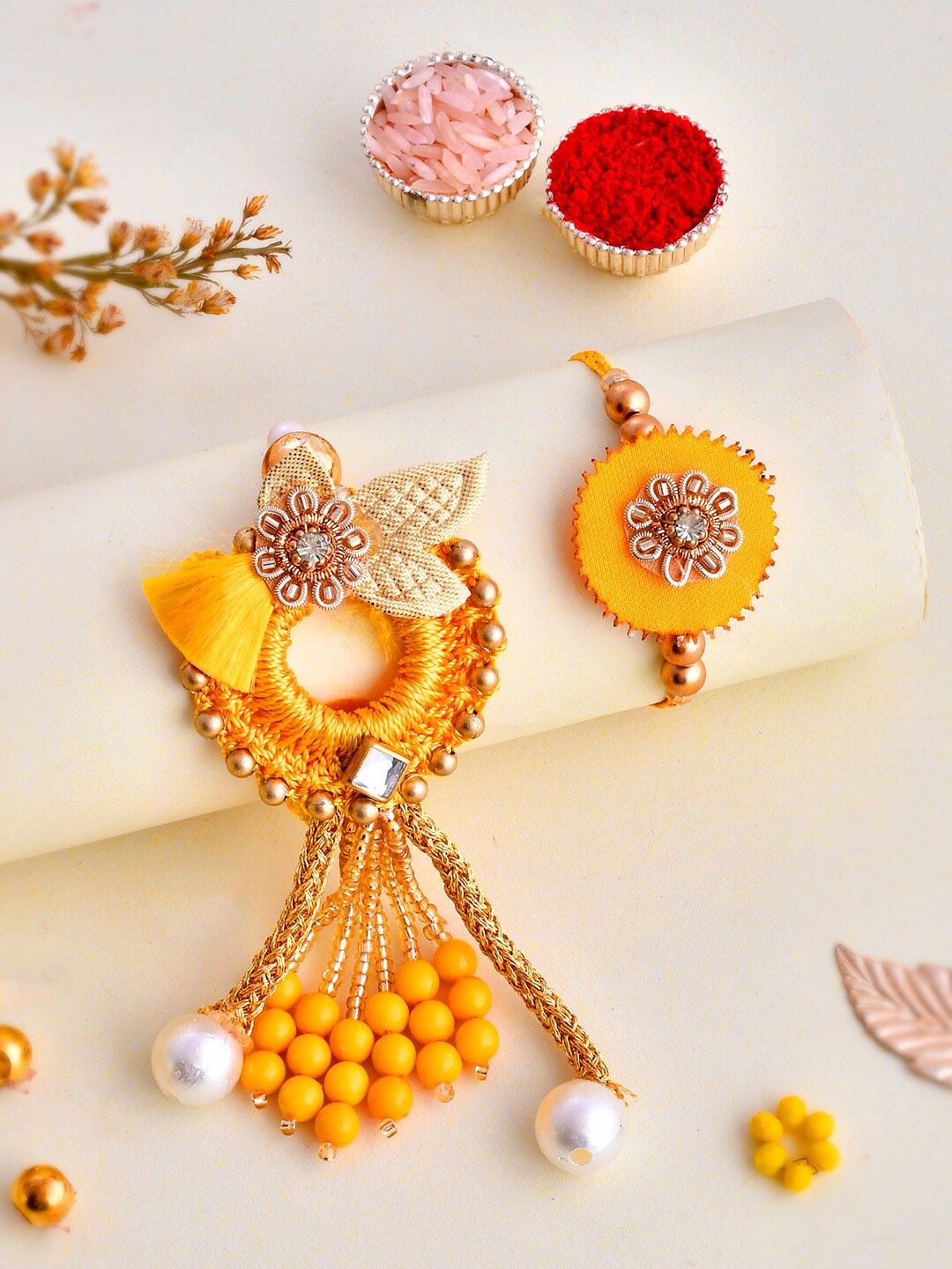 

Aapno Rajasthan Unisex Set Of 2 Charming Bhaiya Bhabhi Rakhi Gift Set, Yellow