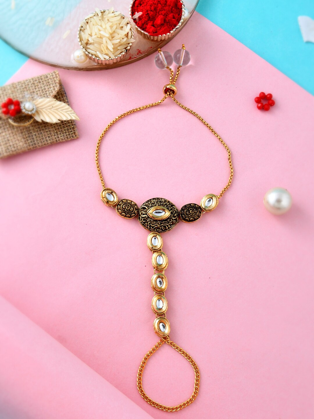 

Aapno Rajasthan Women Kundan Studded Lumba Rakhi, Gold