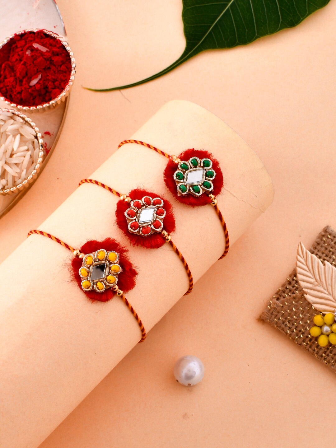 

Aapno Rajasthan Unisex Set of 3 Rakhis, Red