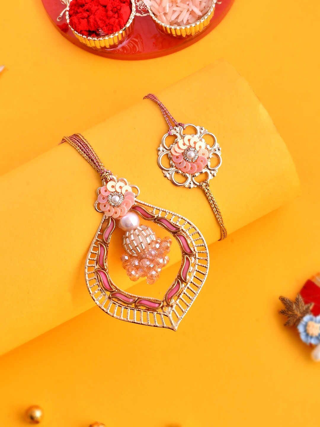 

Aapno Rajasthan Pink Embellished Bhaiya Bhabhi Rakhi Set.