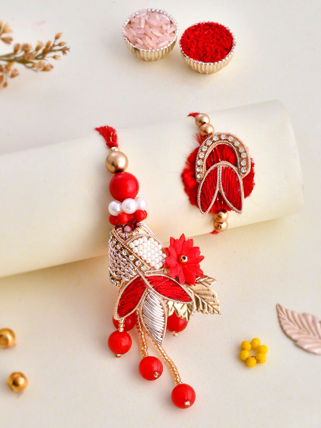 

Aapno Rajasthan Unisex Set Of 2 Beads & Zari Crafted Vibrant Bhaiya Bhabhi Rakhi Gift Set, Red