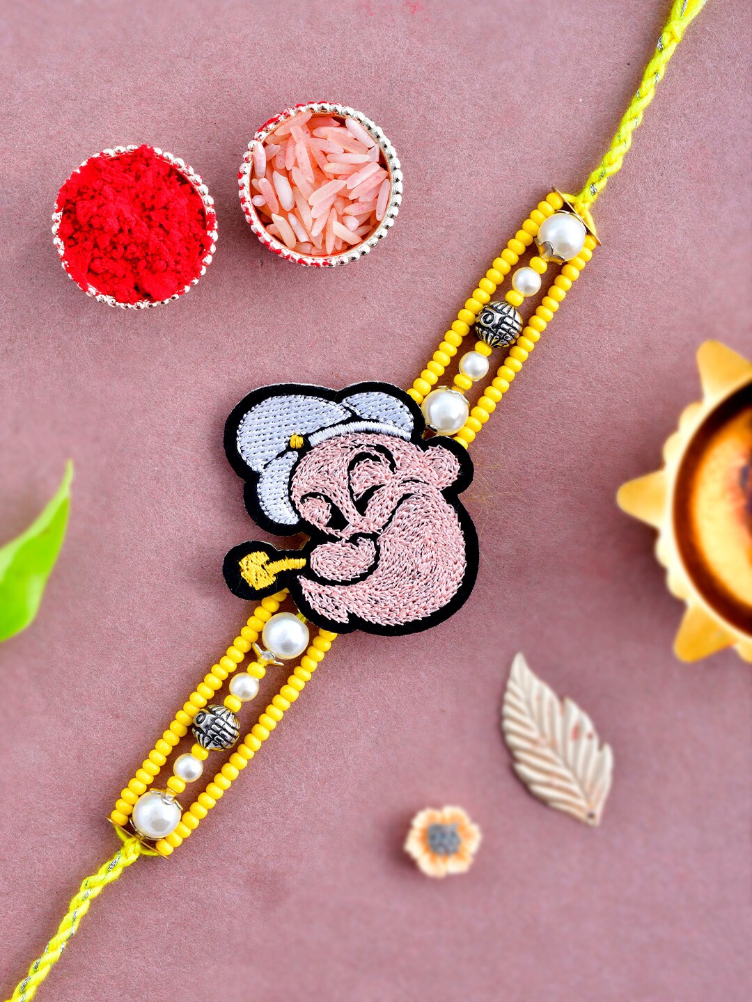 

Aapno Rajasthan Unisex Set Of 3 Beaded Woven Knitted Popeye Rakhi Gift Set, Yellow