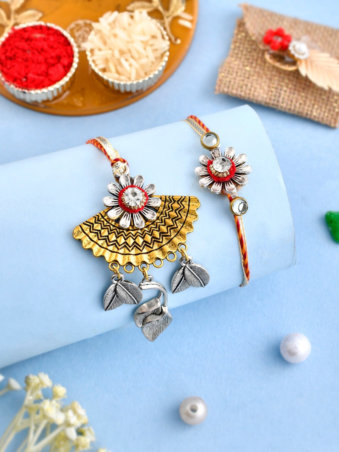 

Aapno Rajasthan Unisex Set Of 2cBeaded Leaf & Flower Bhaiya Bhabhi Rakhi Gift Set., Gold