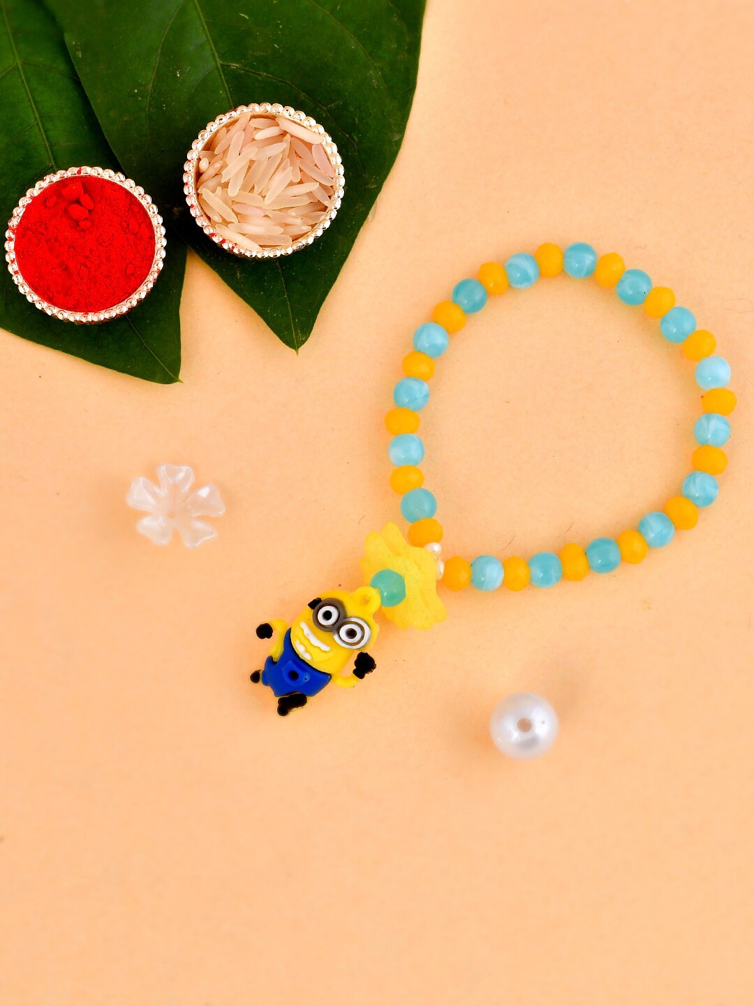 

Aapno Rajasthan Unisex Set Of 2 Pastel Beaded Funky Minion Bracelet Rakhi Gift Set, Blue