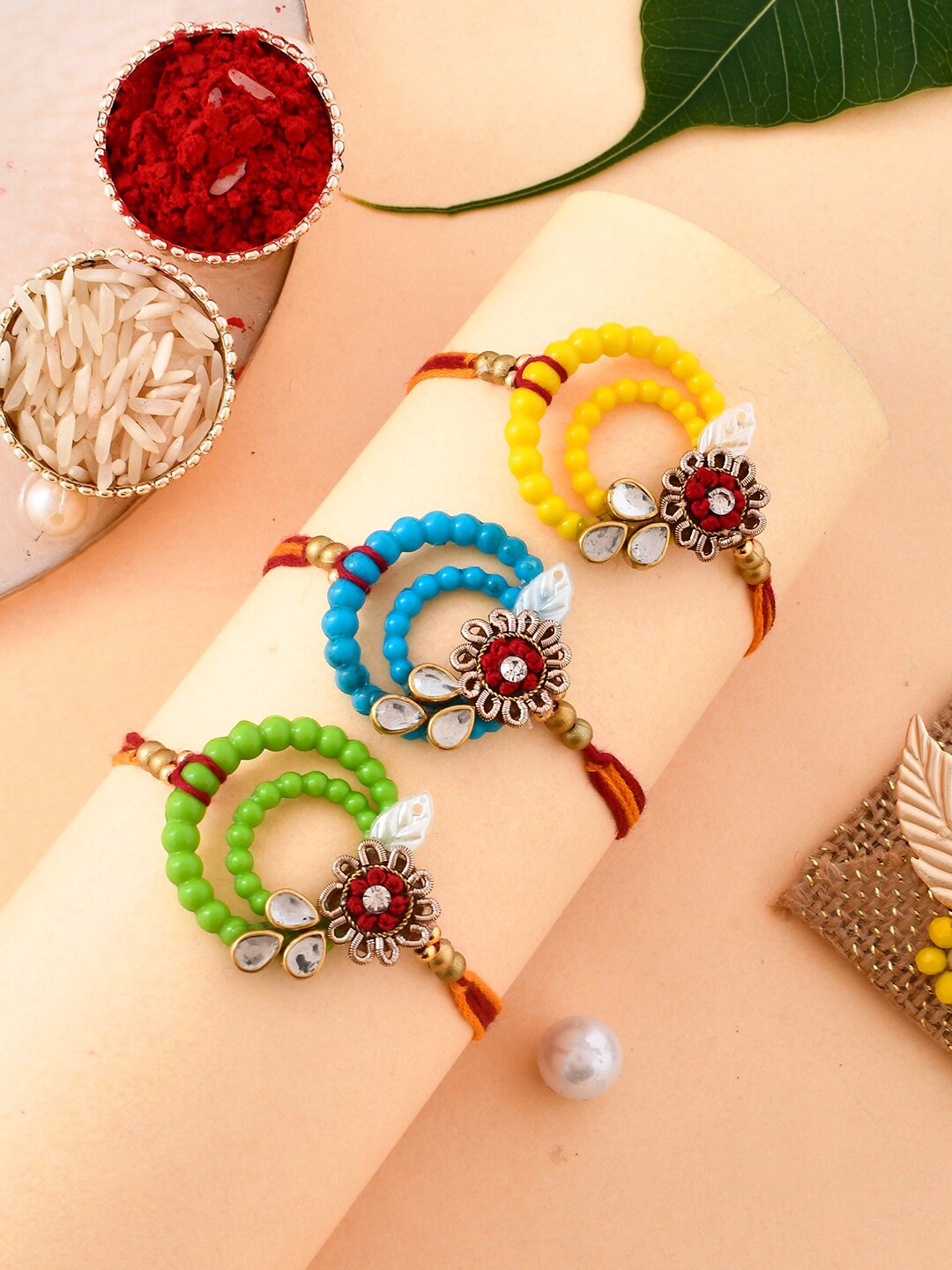 

Aapno Rajasthan Unisex Set Of 3 Resham-Based Pastel Rakhi, Yellow