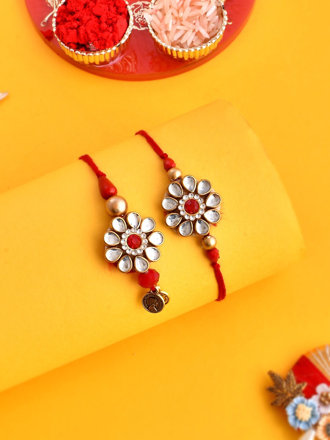 

Aapno Rajasthan Unisex Set Of 2 Kundan Studded Floral Thread Rakhis, Red