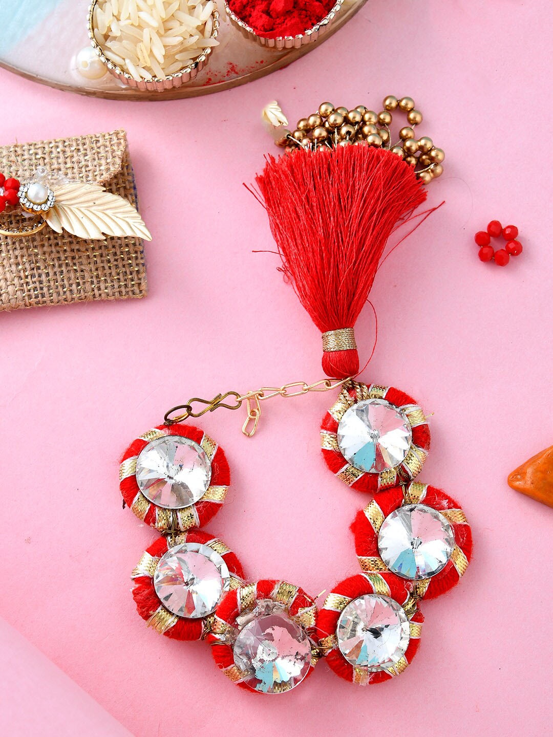 

Aapno Rajasthan Women AD Studded Traditional Lumba Rakhi, Red