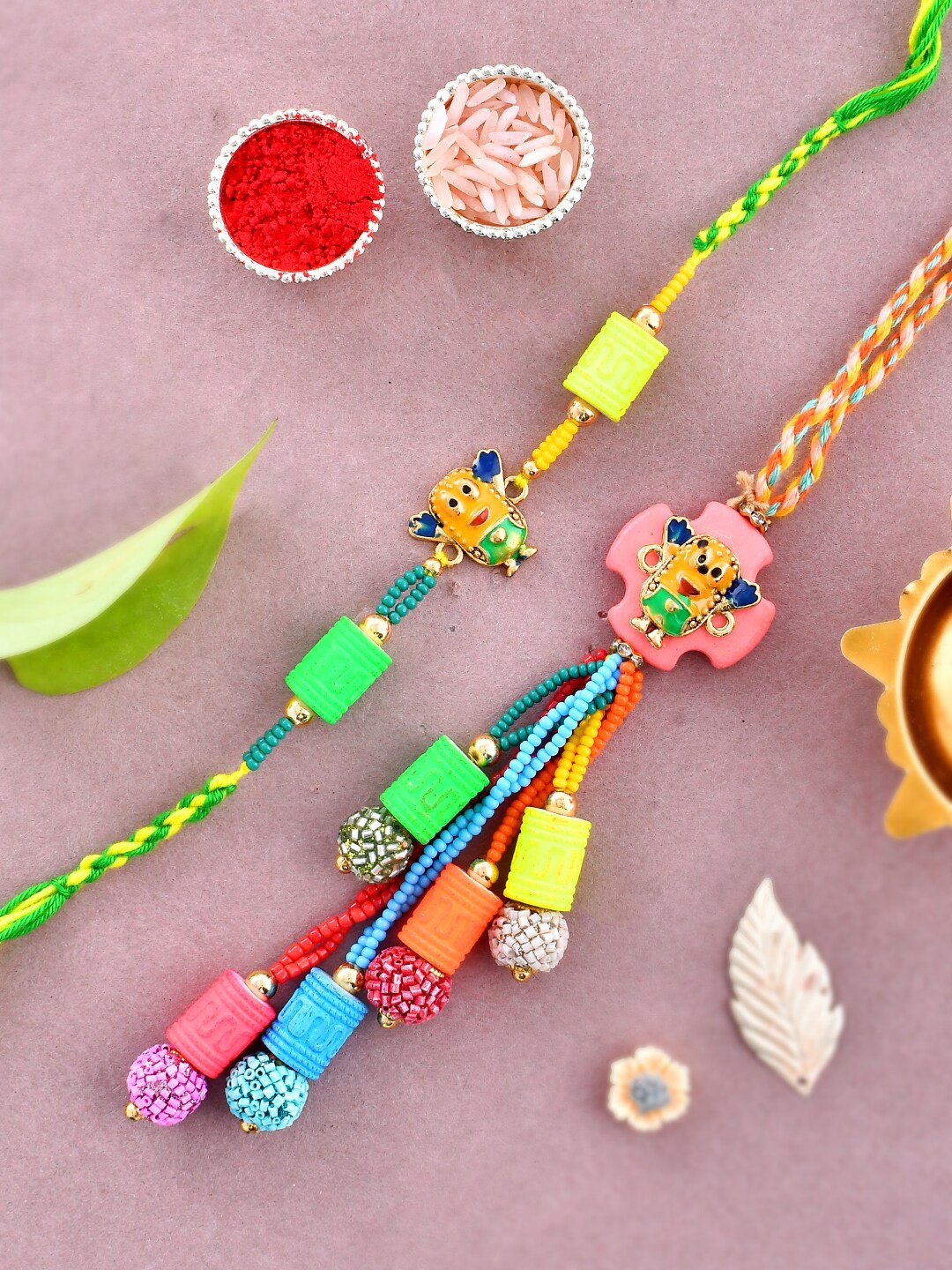 

Aapno Rajasthan Unisex Set Of 2 Embellished Quirky Minion Bhaiya Bhabhi Rakhi Set, Green