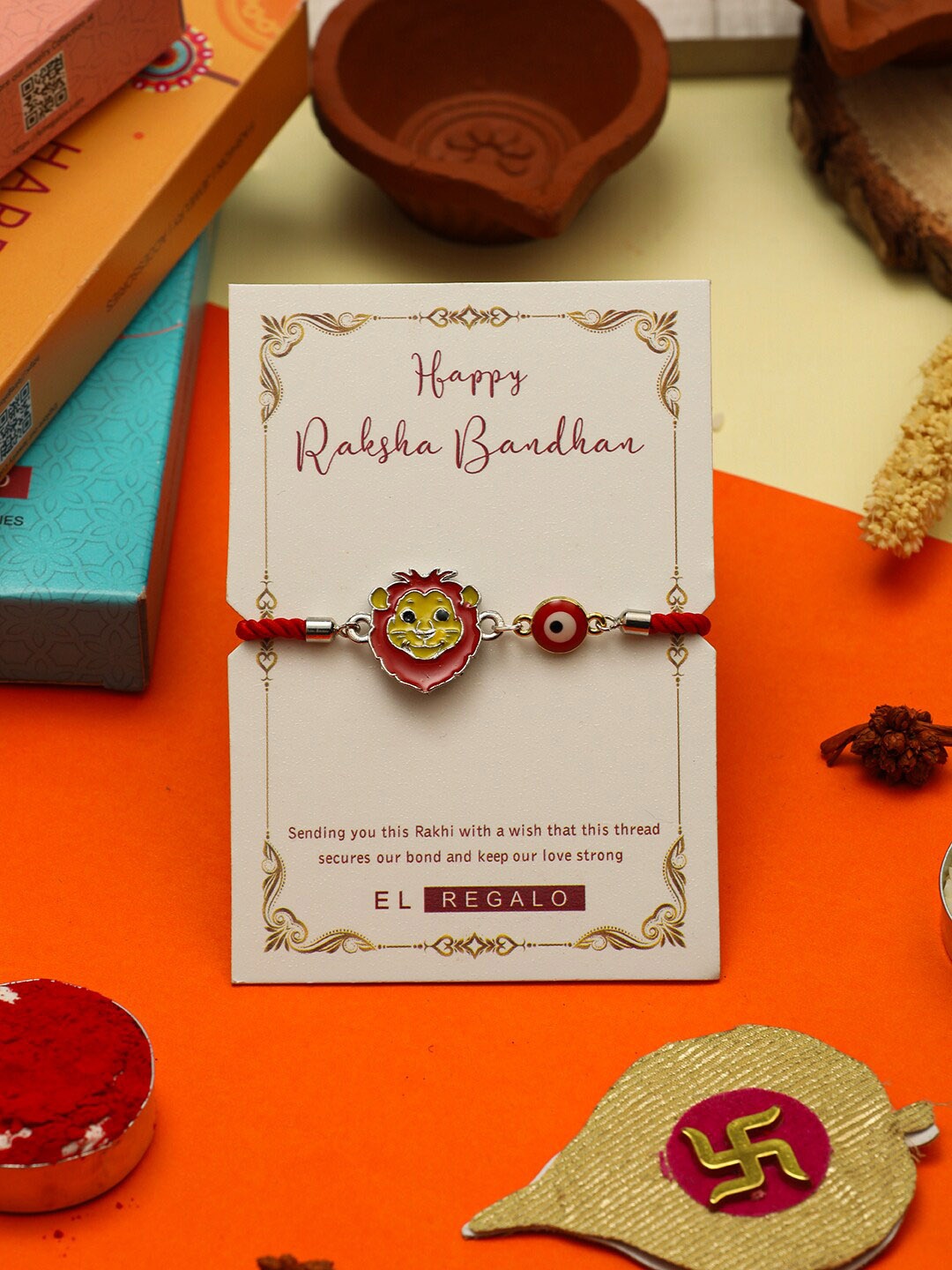 

EL REGALO Boys Lion Design Charm Thread Rakhi With Roli Chawal & Greeting Card, Red