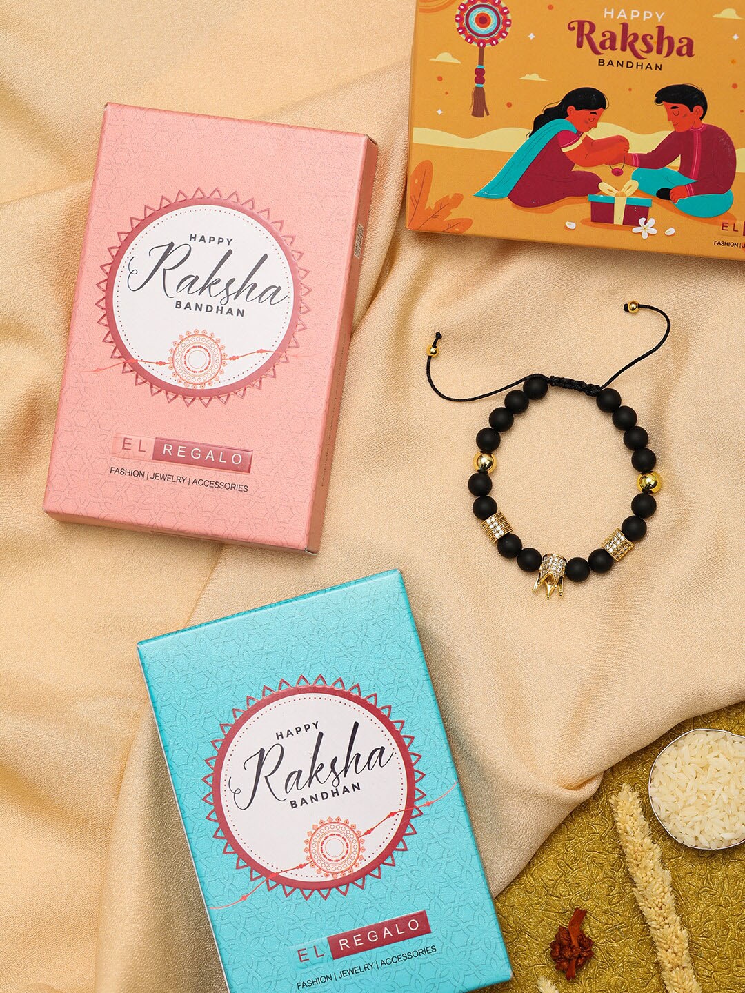 

EL REGALO Men Gold-Plated King Taj Design Tie-Up Rakhi With Roli Chawal Sachet
