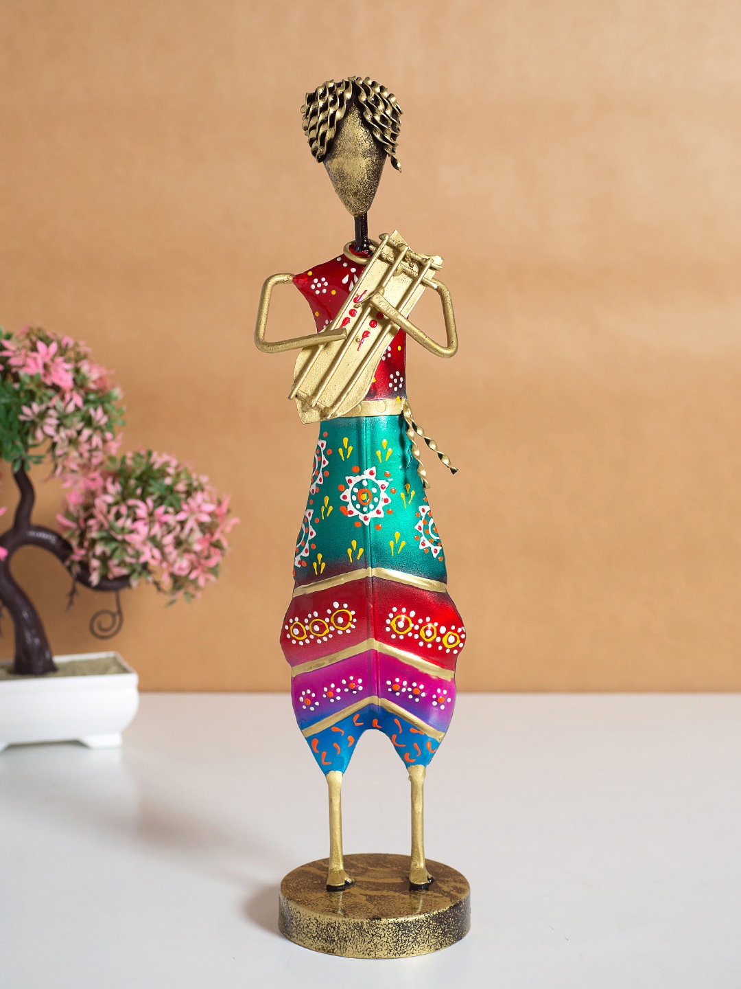 

Golden Peacock Red & Teal Green Textured Musician Figurine Showpiece