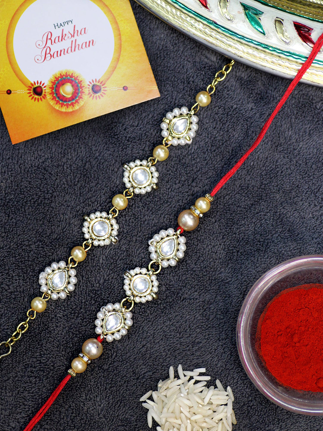 

KARATCART Set of 2 Gold-Plated Rakhi For Bhaiya & Bhabhi With Roli Chawal & Greeting Card