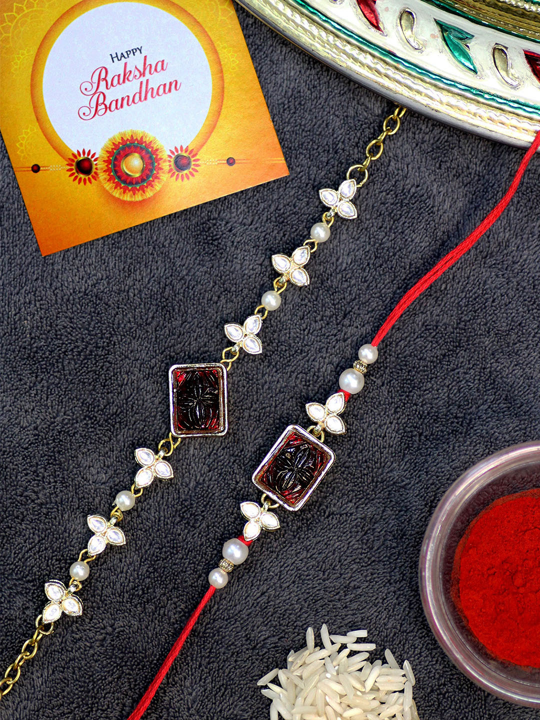 

KARATCART Set of 2 Gold-Plated Rakhi For Bhaiya & Bhabhi With Roli Chawal & Greeting Card, Maroon