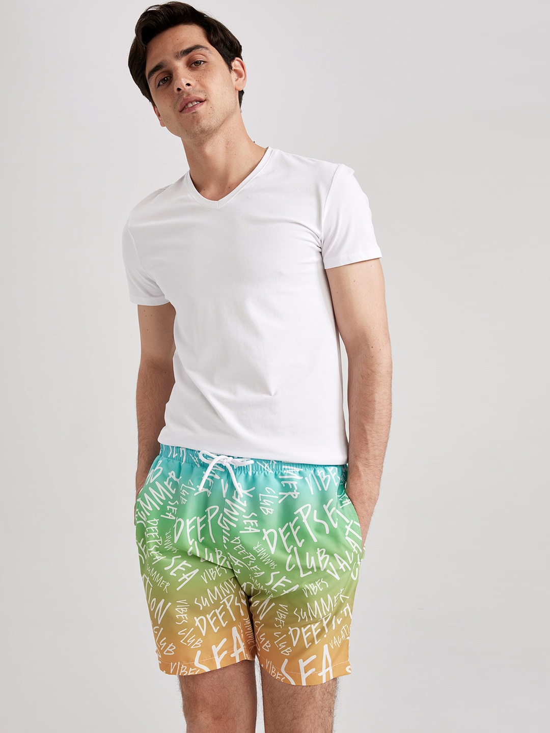 

DeFacto Men Typography Printed Mid-Rise Swim Shorts, Blue