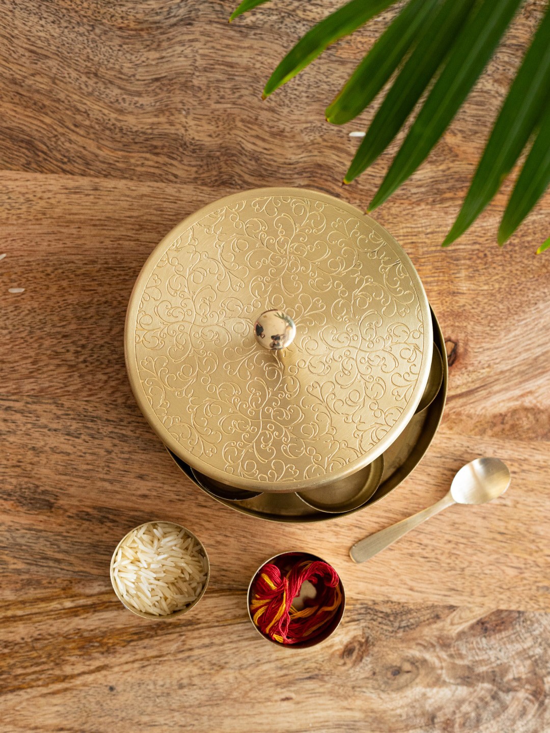 

ExclusiveLane Floral Vine Etched Pooja Box With Spoon, Gold