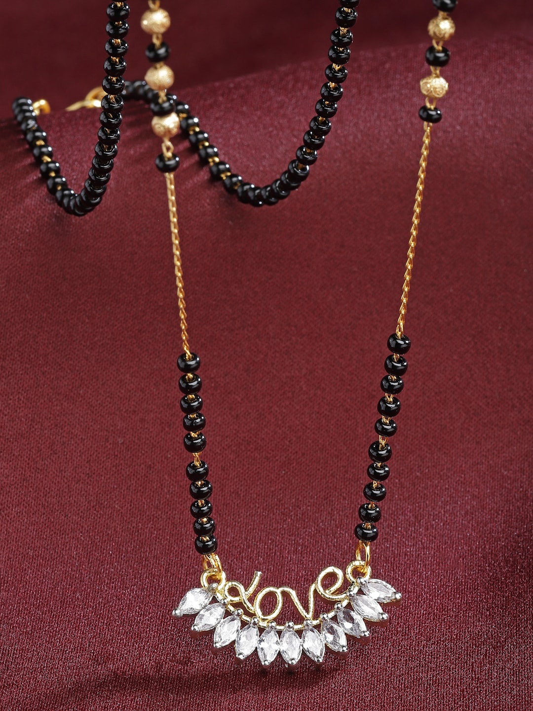 

Kennice Gold-Plated American Diamond Studded & Beaded Mangalsutra