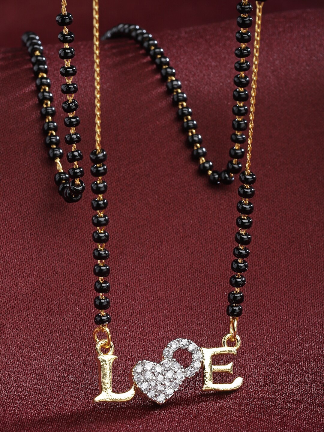 

Kennice Gold-Plated American Diamond-Studded & Beaded Love Pendant Mangalsutra